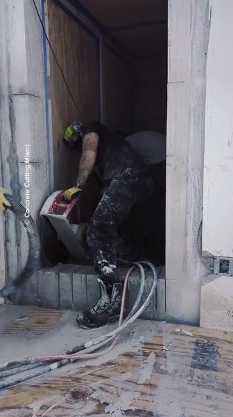 Removing a nasty 8 inch thick solid concrete wall with rebar